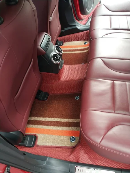 interior of a car with a red leather belt