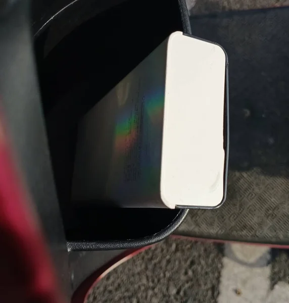 smartphone with a car on the screen