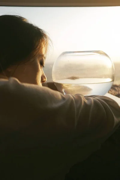 woman drinking water from a bottle of milk