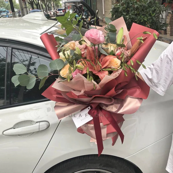 beautiful wedding bouquet of roses in the car