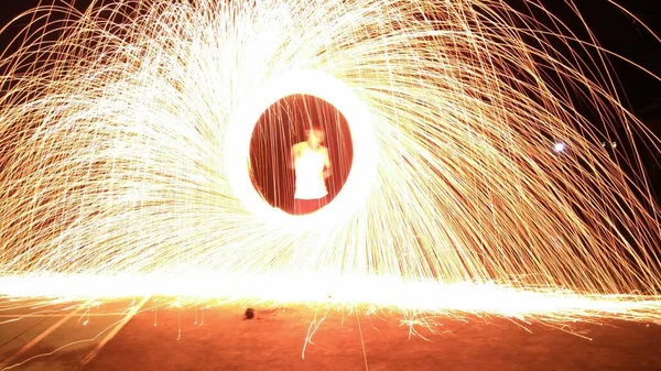 close up of a female hand with a fire