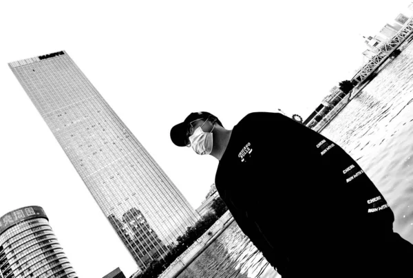 black and white photo of a man in a suit and a hat