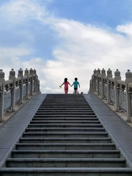 silhouette of a man and woman in the sky