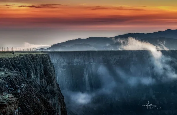 beautiful landscape with mountains and fog