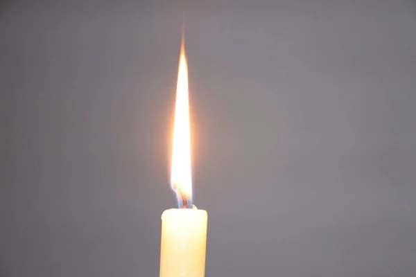 candle burning on a white background