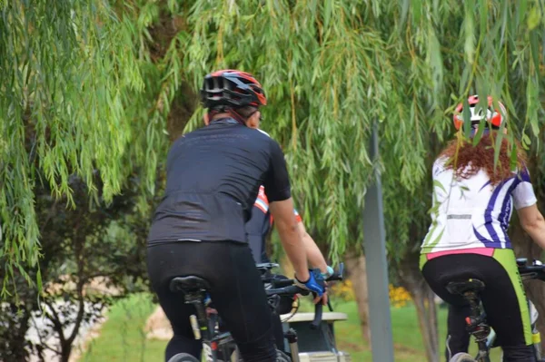 young man riding bicycle in the forest