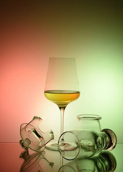 glass of champagne and a bottle of wine on a dark background