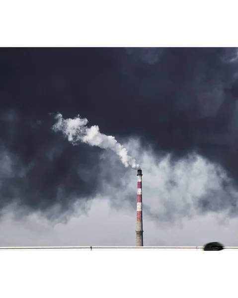 industrial chimney on the background of the factory