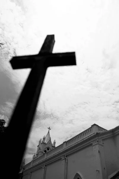 old wooden cross on the background of the sky