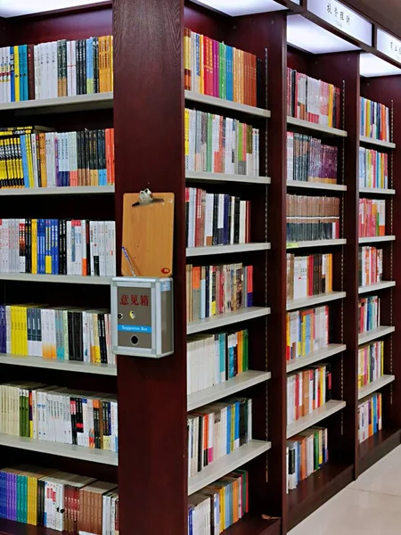 library with books and bookshelves on the bookshelf. 3d illustration.