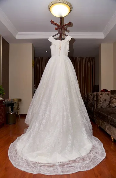 wedding dress. bride and groom in the room.