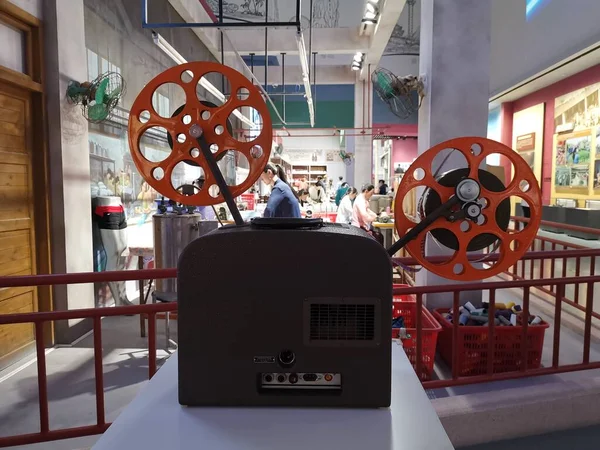 movie film reel with a lot of cinema equipment