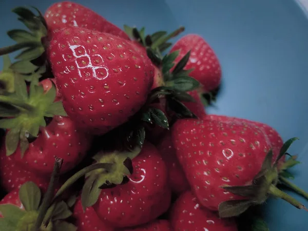 fresh strawberries on a black background