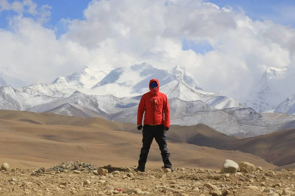 hiker with backpack and trekking in the mountains