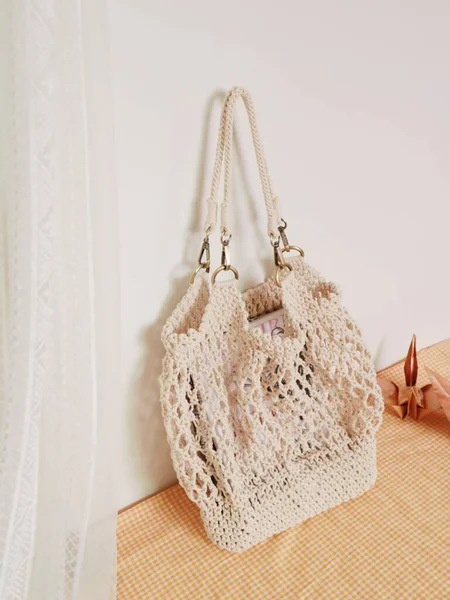 bag with knitted scarf on a white background