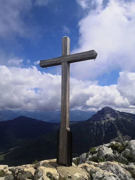 cross-shaped sign on a mountain lake in the mountains