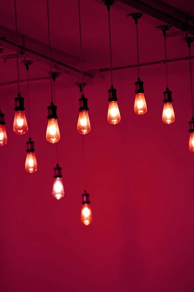 red light bulbs hanging on ceiling