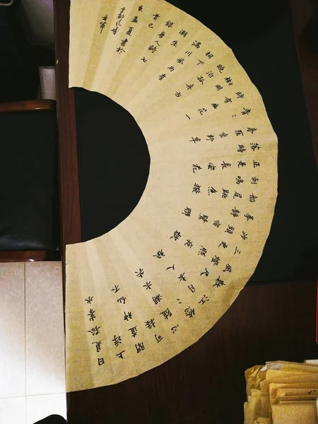 old wooden table with a paper and a star