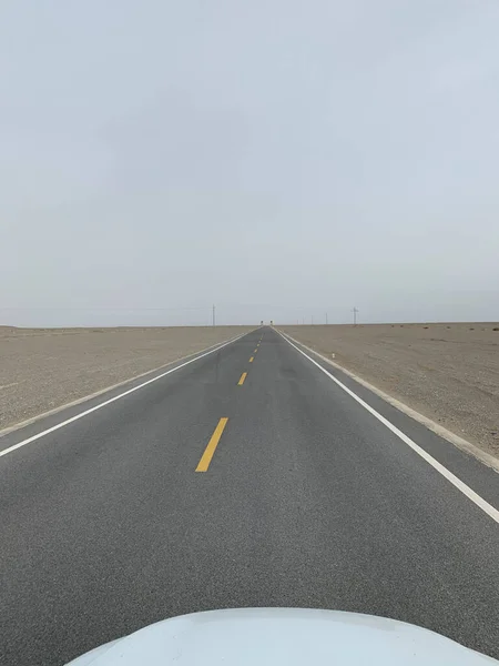 empty asphalt road in the desert