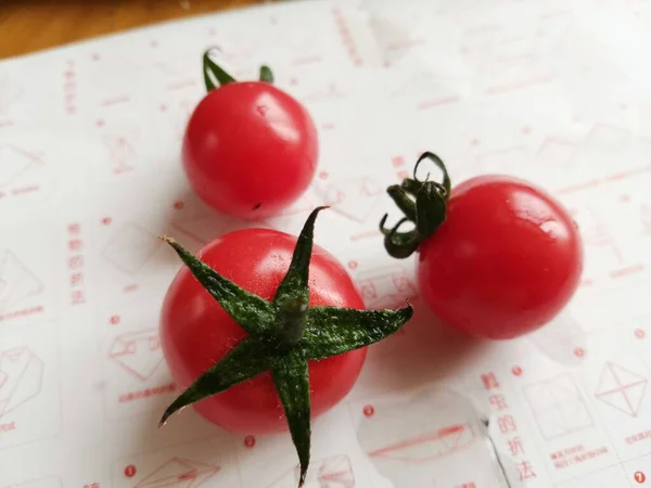 tomato and cherry tomatoes on a white background