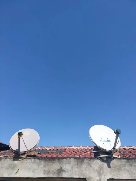 stock image satellite dish on the roof of the house