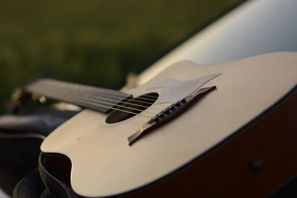 acoustic guitar on the background of the piano