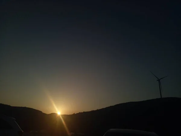 outdoors landscape with electricity turbines, wind power technology