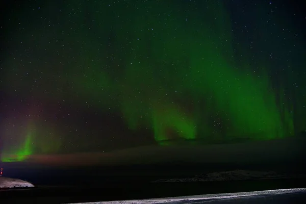 northern lights over the arctic mountains