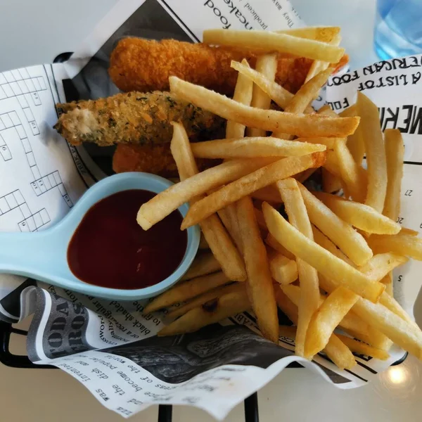 french fries and chips on a plate