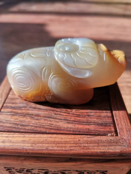 a closeup shot of a beautiful brown soap on a wooden table