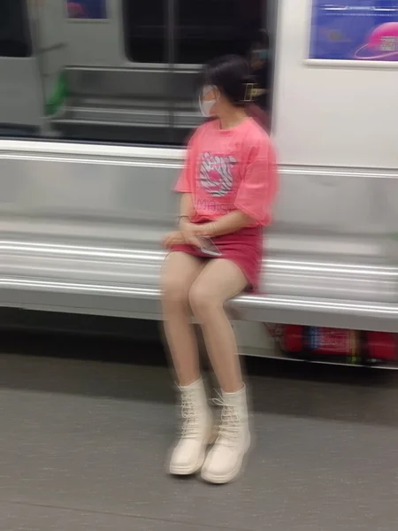 woman walking in the subway station
