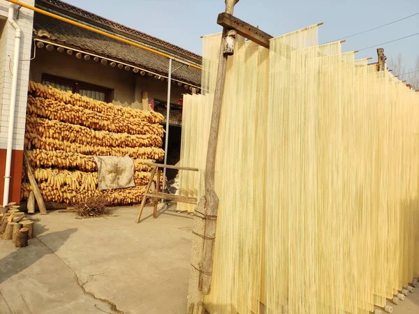 a closeup shot of a wooden fence with a straw