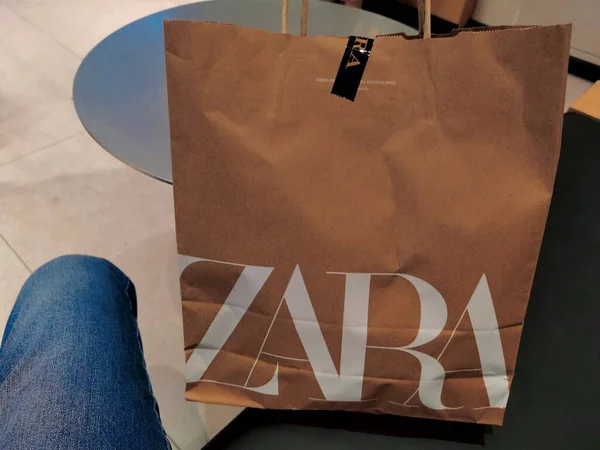 shopping bag with paper bags and text on the wall