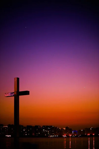 christian cross on the background of the sunset