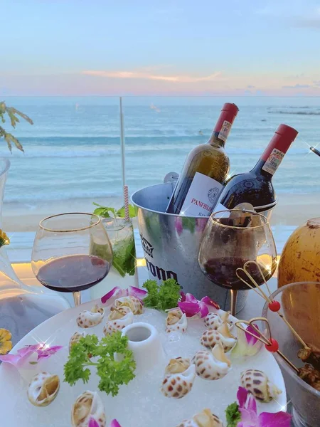 wine glasses and sea on the beach