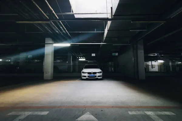 empty parking lot, underground garage, night scene