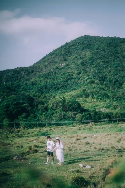 young couple in love walking in the mountains