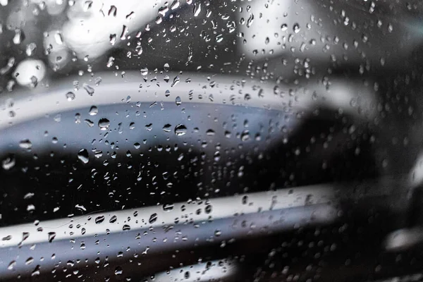 raindrops on glass window, rain drops on the car