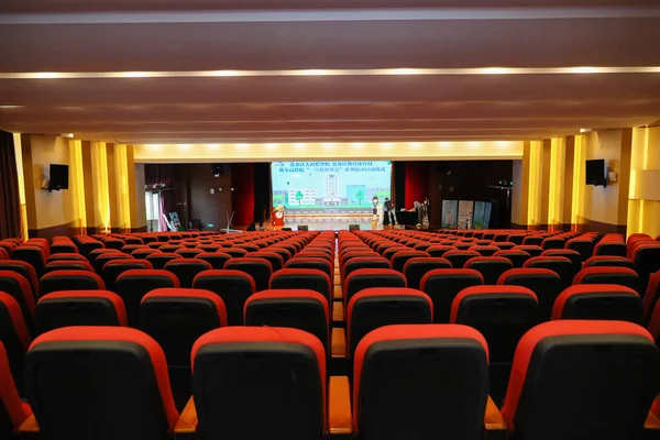 empty cinema hall with seats and chairs