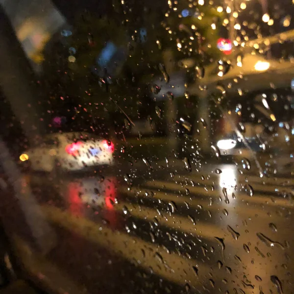 car rain drops on the street