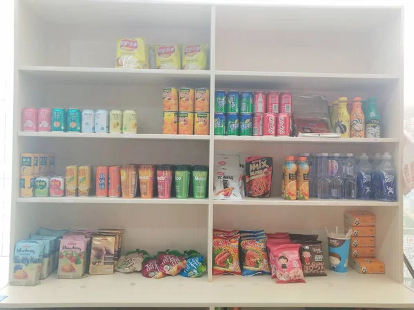 shelves with different colorful flowers in the store