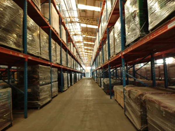 warehouse shelves with a lot of goods