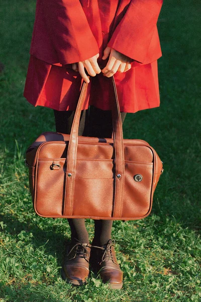 woman with bag and leather jacket