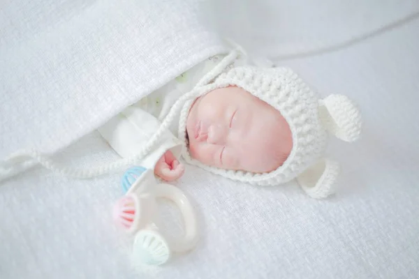 newborn baby in a white blanket