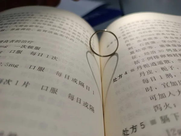 close up of a book with a bible and a heart