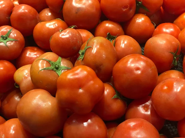 fresh ripe tomatoes in a market