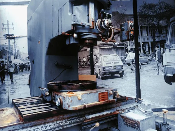 old rusty metal cutting machine with a large steel