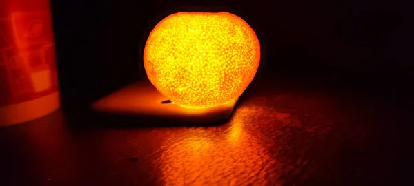close up of a red and orange light bulb