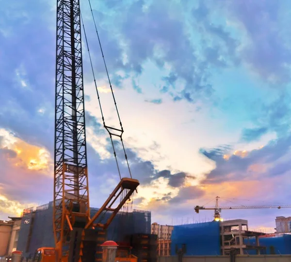 industrial construction site with cranes and crane