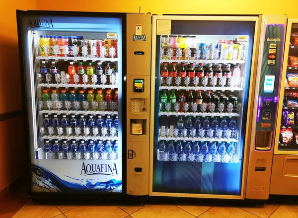 a large display of a wine machine in a supermarket